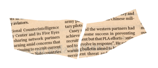 Newspaper with torn edge and text close up detail view of paper