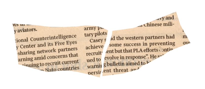 Newspaper with torn edge and text close up detail view of paper