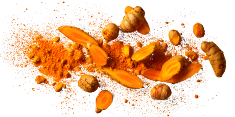 Vibrant turmeric root and powder exploding on black background