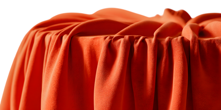 Close up of draped orange fabric with soft folds and texture