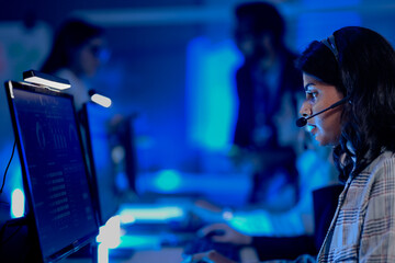 Data integrity check night shift Diverse team meticulously audits financial performance comparing...