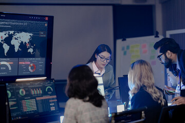 Global security watch active Diverse analysts monitor world map threat intel screens leader coordinates response strategy critical vigilance protects assets worldwide team focus now protect.