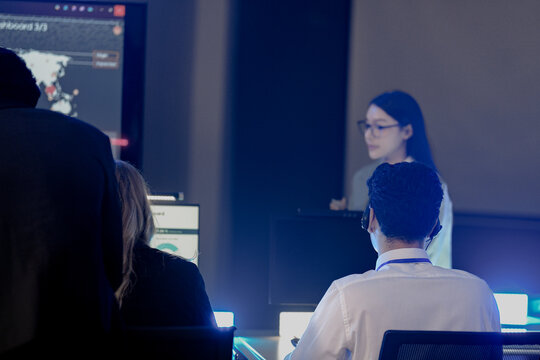 A focused female technician in full protective gear meticulously performs a quality control test in a bright, sterile laboratory, ensuring the highest standards of precision and safety.