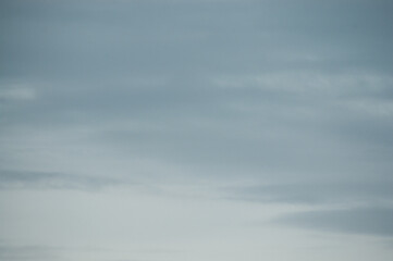 pastel blue background, in the photo blue gray sky