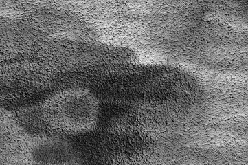Gray background, photo of a gray wall texture with various lines and strokes of black, white, and gray paint