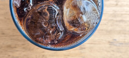 Black soda in a glass.