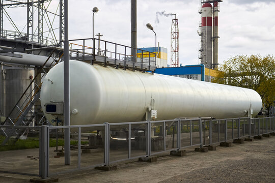 Huge horizontal liquid nitrogen tank for needs of medical institutions and hospitals and cylindrical oxygen gas-holder as example of chemical equipment example.