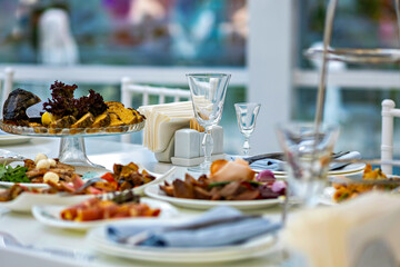 A table set with a variety of food and drinks ready for a meal