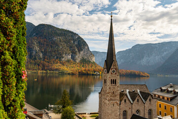 Hallstatt Austria Church and Lake View in Autumn with Mountain Reflection and Scenic Village Landscape