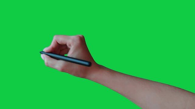 A woman's hand draws a draws a circle with a stylus. Female hand gesture drawing with stylus on chroma key green screen background. Girl's hand guesture with stylus: circle, circumference, outline