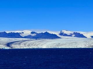 Jökulsárlón Glacier Lagoon and Diamond Beach in South Iceland with Floating Icebergs and Volcanic Landscape