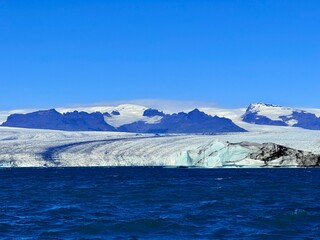 Jökulsárlón Glacier Lagoon and Diamond Beach in South Iceland with Floating Icebergs and Volcanic Landscape