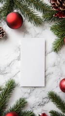 Holiday Decorations With Blank Card and Ornaments on Marble Surface