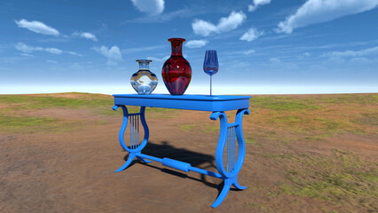 Vases and a glass cup on blue table in a meadow