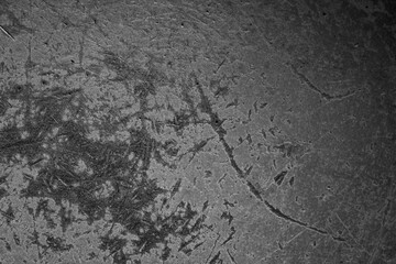 black old aluminum sheet with burnt marks from the pan