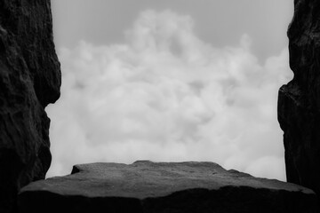 Low Rock Top Product Display Shelf Blurred Walls Cloudy White Grey Background.