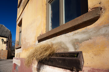 Cobblestone Street with Retro Lantern and Historic Buildings in Kandava Old Town