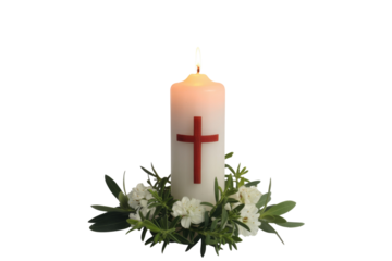 A lit white candle featuring a red cross, adorned with a wreath of white flowers and green foliage, against a vibrant transparent background. background removed