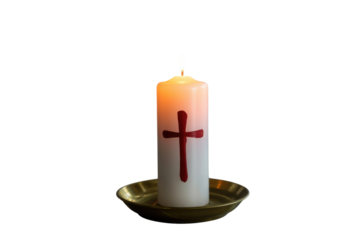 A lit white pillar candle featuring a prominent red cross, resting in a golden brass holder, symbolizing faith and remembrance. background removed