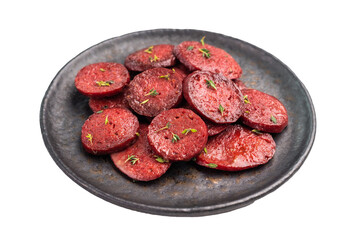 Pan-fried Turkish sucuk (sujuk) slices garnished with thyme on a dark plate. Spicy sausage breakfast or appetizer.