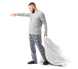 Naklejka premium Male sleepwalker in pajamas with blanket on white background