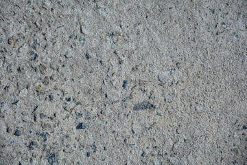Rough gray concrete surface background with natural stone grain pattern