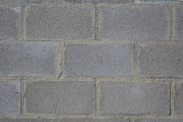 Gray brick wall pattern with concrete blocks and industrial masonry texture