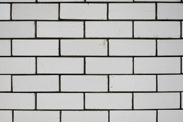 Pure white brick texture on wall with geometric rectangular pattern