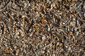 Dry bark and mulch background with mixed brown tones and natural texture