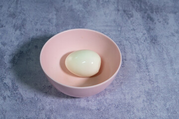 
Boiled eggs in bowl on top table