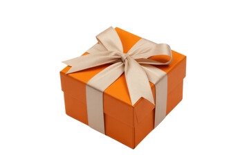 Fototapeta premium A vibrant orange gift box, elegantly tied with a delicate beige ribbon and bow, presented on a clean transparent background. background removed