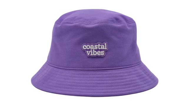 A vibrant purple bucket hat with a stylish 'coastal vibes' white embroidered patch, perfect for sunny beach days or summer outfits. background removed - Powered by Adobe