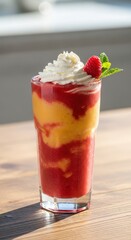 Vibrant Layered Fruit Smoothie with Whipped Cream and Fresh Raspberry Garnish