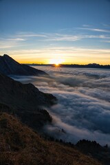 Breathtaking sunrise on the L&uuml;tispitz in Toggenburg. Sunrise above the sea of ​​fog in the Alpstein region. Wonderful mountain panorama. High quality photo.