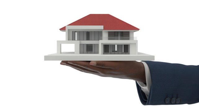 Close up of a hand in a suit holding a white architectural model of a modern house with a red roof isolated on transparent background