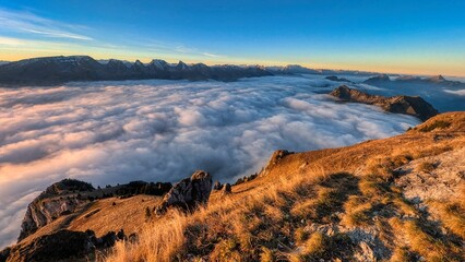 Breathtaking sunrise on the Luetispitz in Toggenburg. Sunrise in the Alpstein region above the fog. Wonderful mountain panorama. High quality photo