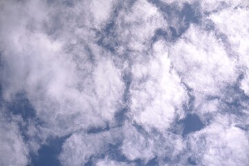Fluffy White Clouds Against a Deep Blue Sky.