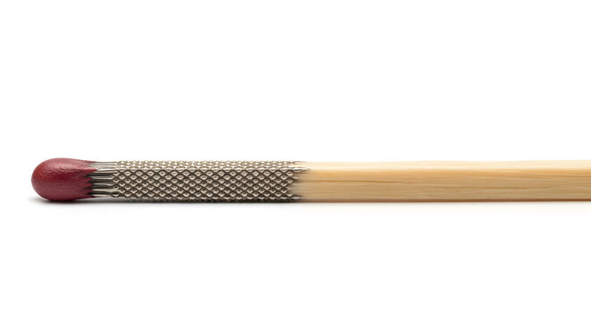 Matchstick Close-up: a matchstick with its detailed head, ready to ignite, is captured in exquisite detail, showing its potential for sparking.