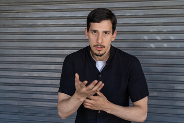 Young man talking and gesturing with hands