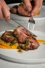 Slicing Medium Rare Steak With Chimichurri Sauce