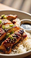 Delicious Glazed Teriyaki Chicken and Rice Bowl with Sesame Seeds and Scallions