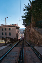 Cogwheel tracks in Genoa, Italy under a blue sky