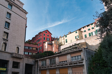 Buildings in the city of Genoa under a blue sky in the morning