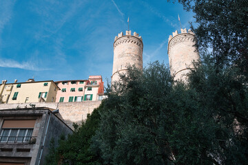 Porta Soprana in Genoa with olive tree and blue sky