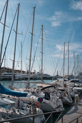 Port of Genoa with sailing ships and the lighthouse in the background