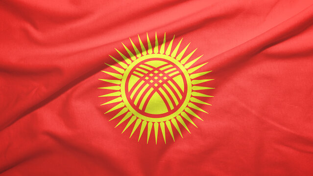 Kyrgyzstan national flag waving fabric texture close-up &ndash; Kyrgyz Republic red banner with yellow sun and tunduk symbol detailed textile background patriotic concept high resolution tricolor fabric