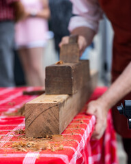 Woodworker Using Traditional Hand Plane on Timber Beam