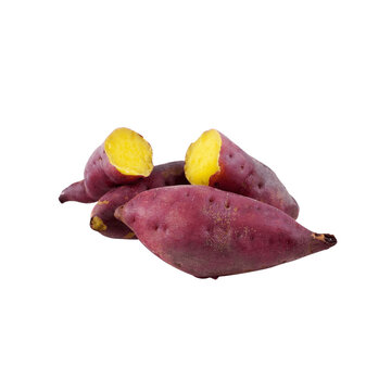 Vibrant purple sweet potatoes with bright yellow flesh isolated on a stark black background showcasing their natural beauty