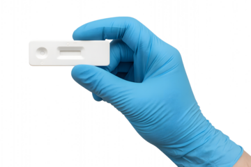 A person in medical glove holding a testing kit.