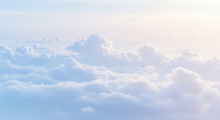 Fototapeta premium Fluffy white clouds in soft blue sky with gentle sunlight